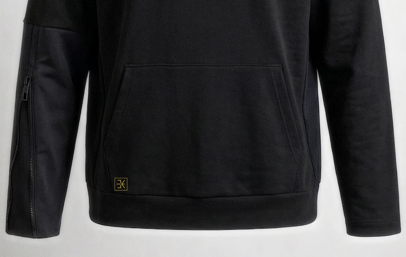 Goldenes eWear-Zeichen am Saum